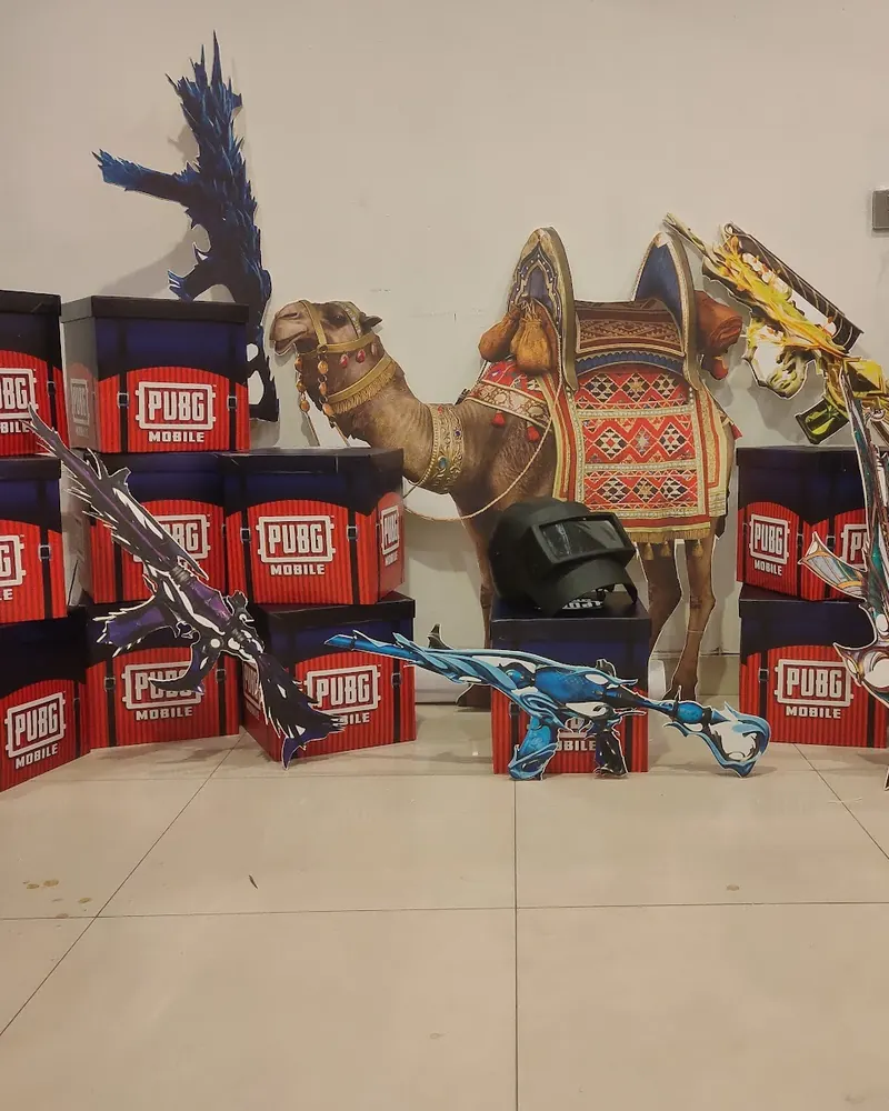 Printed boxes and cut-out standees at an event